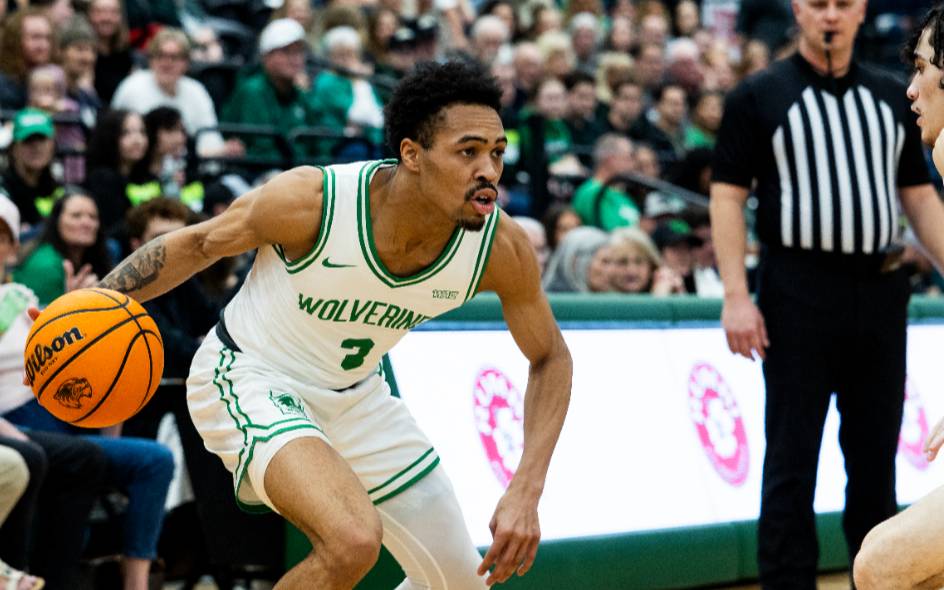 student athlete playing basketball