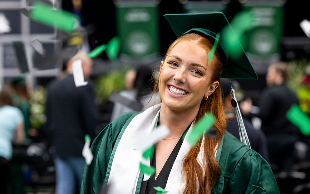 female graduate student in cap and gown