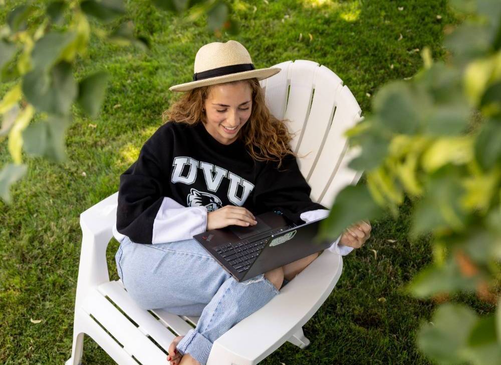girl student working on laptop