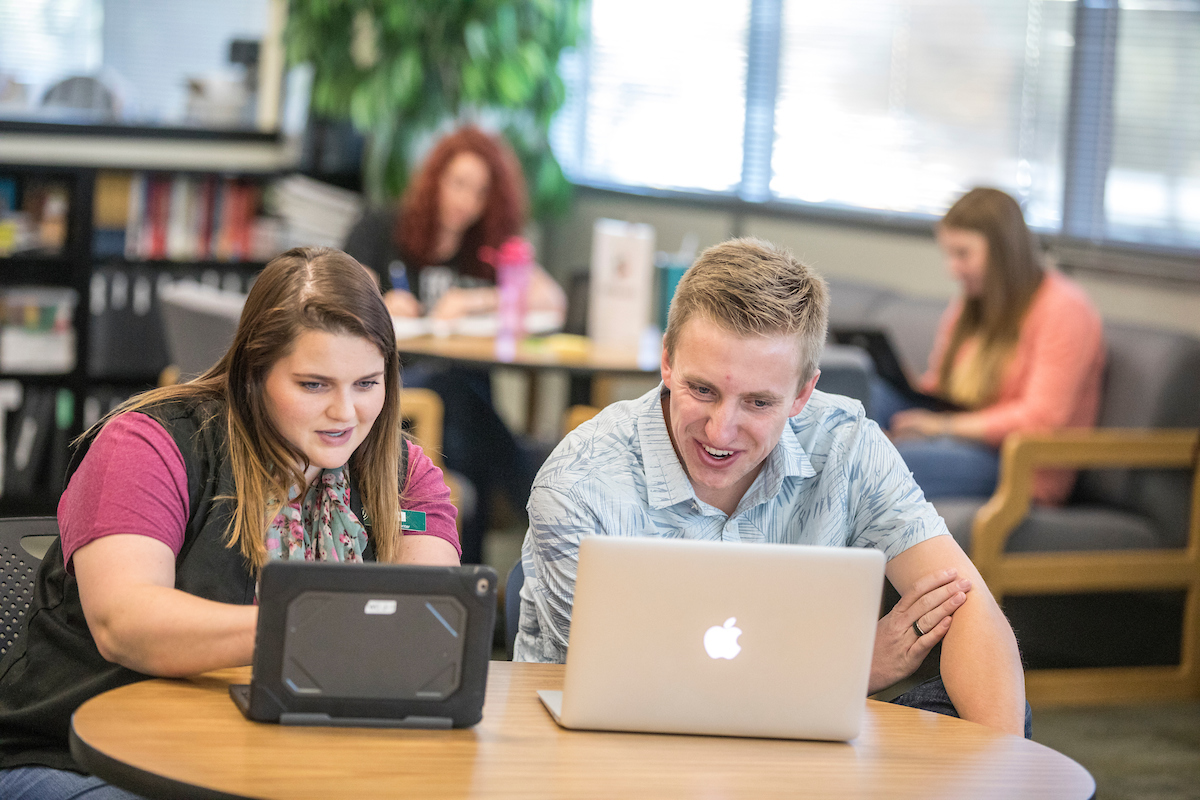 Students looking at a laptop screen