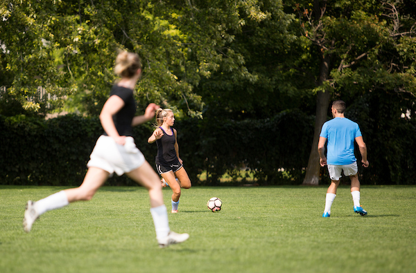 Students playing intramural soccer.