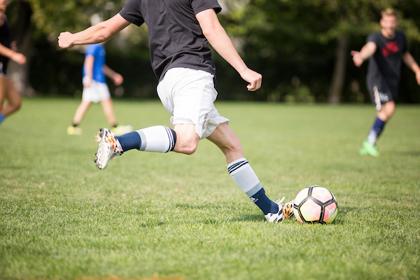 Students participate in a soccer game.