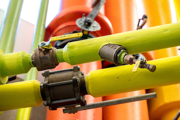 Picture of green and yellow colored pipes on UVU campus