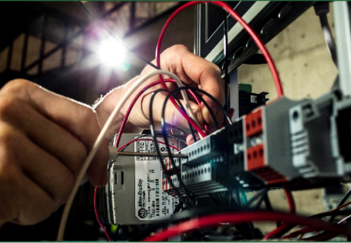 Person testing electrical connections