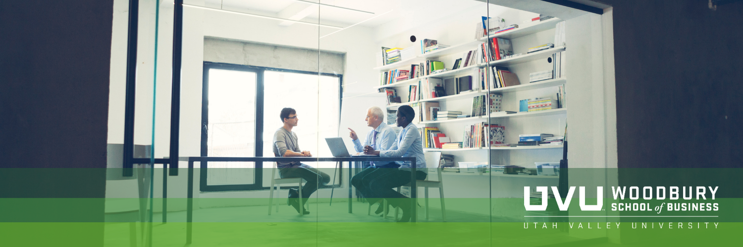 A young man's job interview in a conference room with a man and a woman