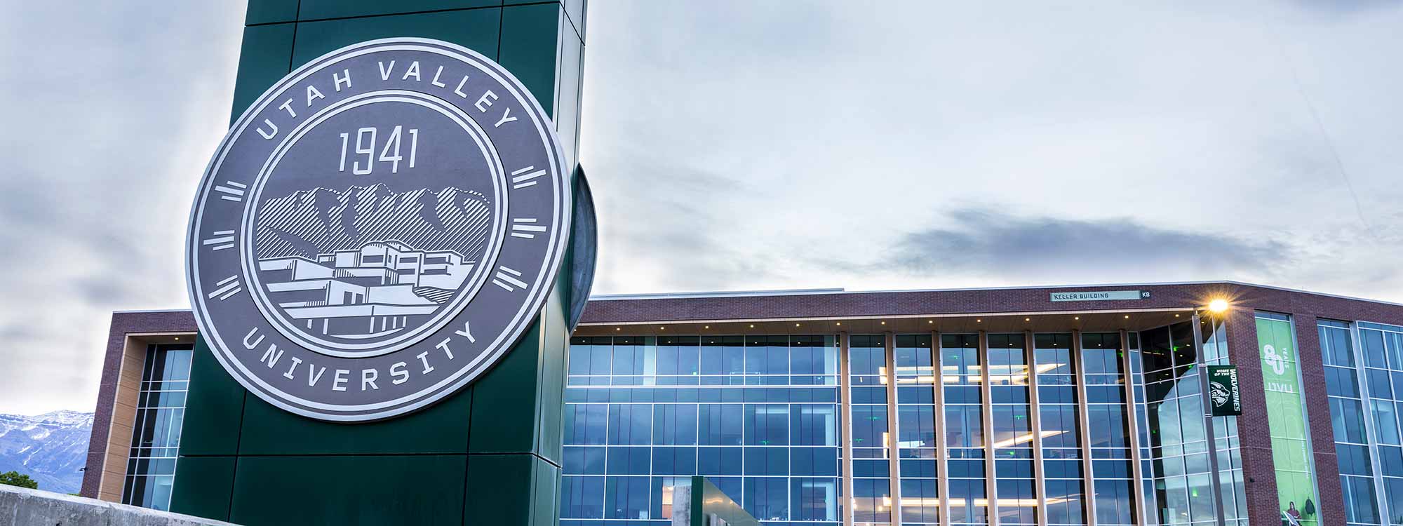 The UVU seal sign in front of the Keller Building.