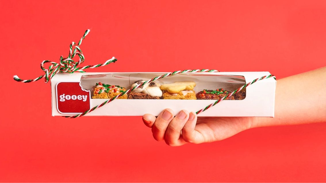 Box featuring variety of Gooey Gourmet Brownies