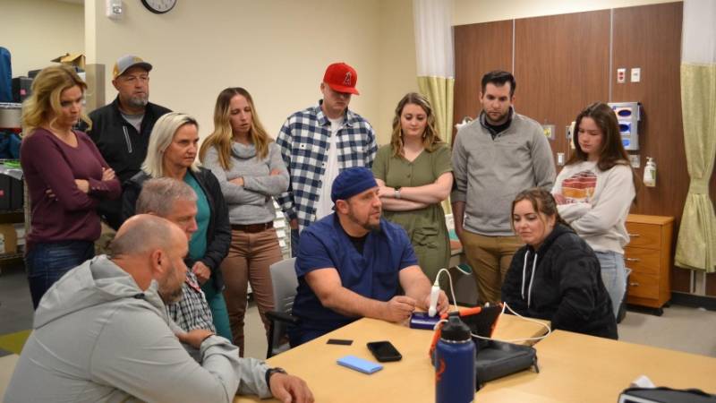 Teleflex giving training on a medical device