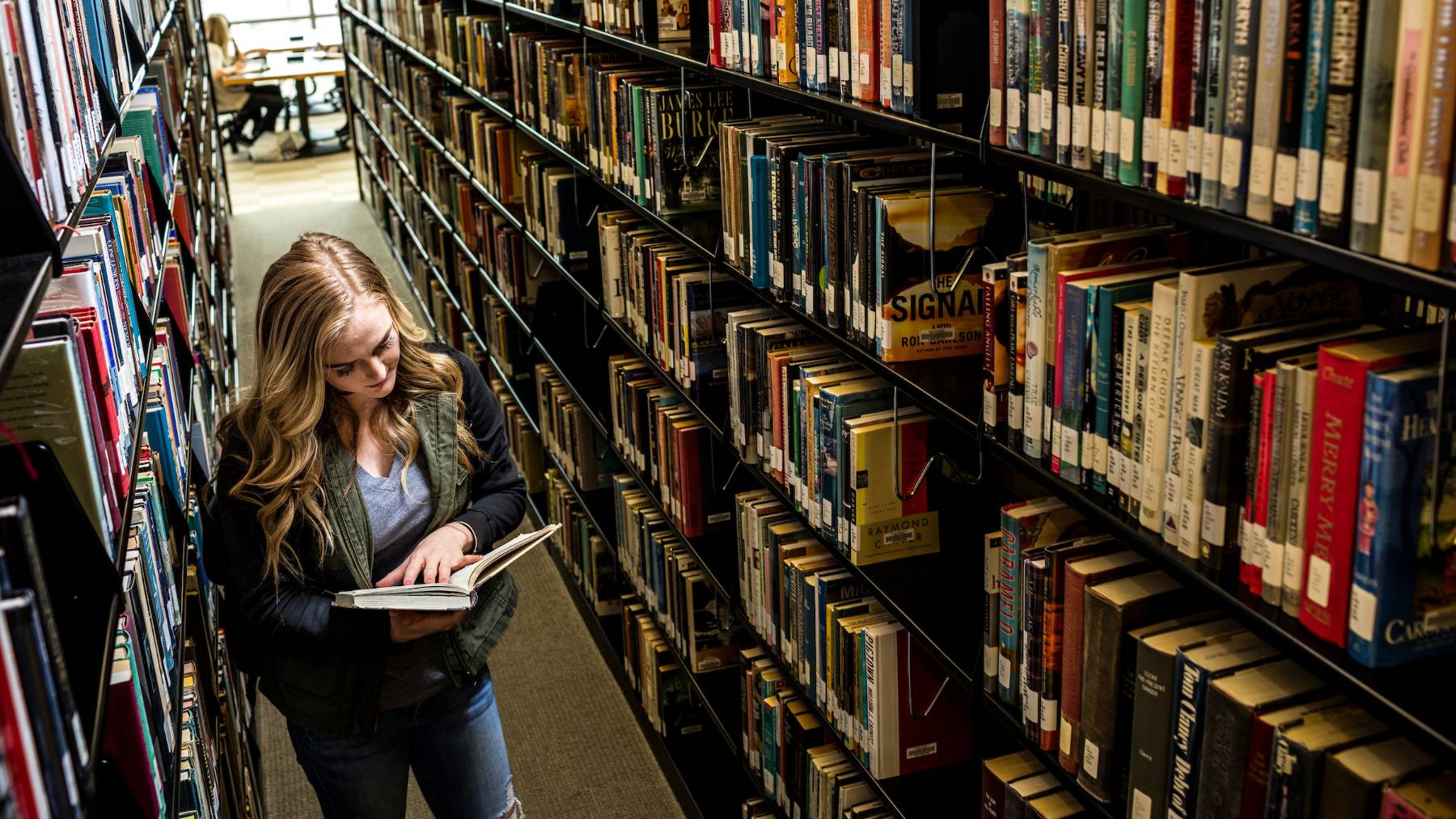 Student reading in library