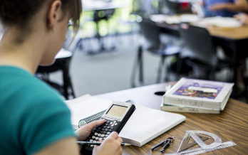student using a calculator