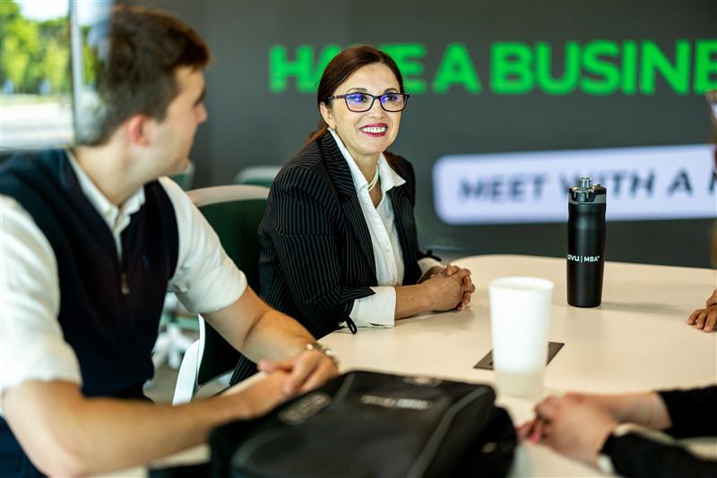 two business professionals sitting at a table