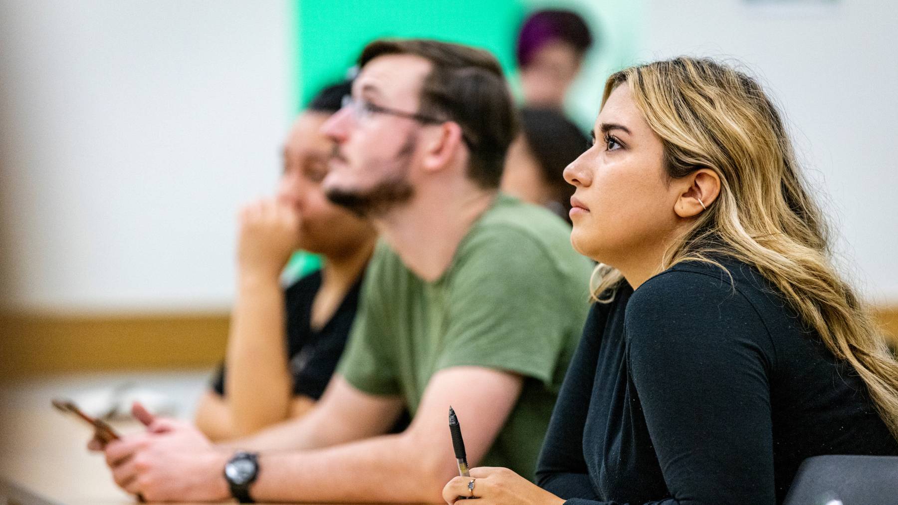 Woodbury School of Business students attend a lecture.