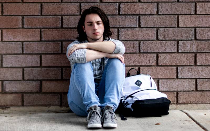 student alone in deep thought