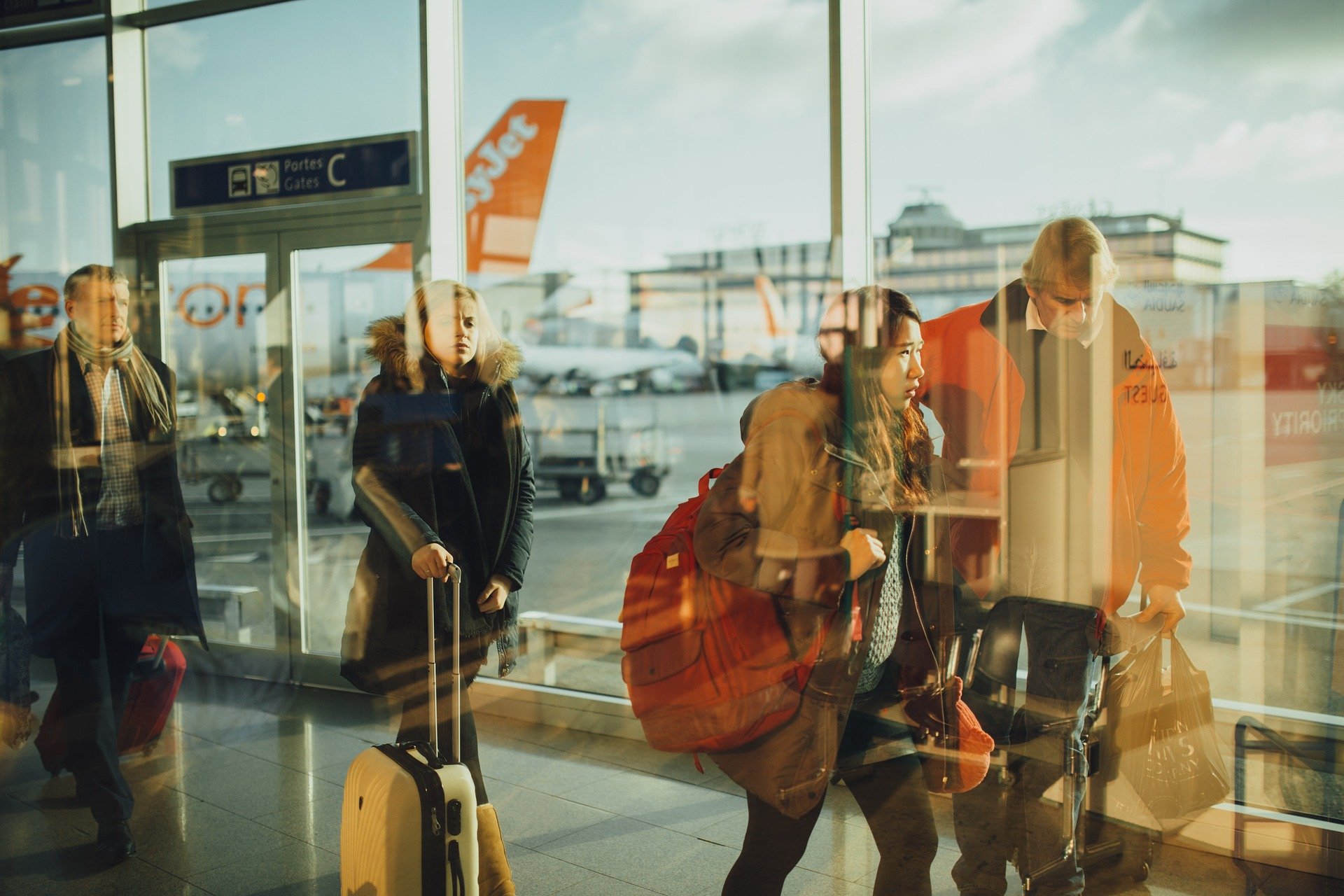 Travelers walking through an airport