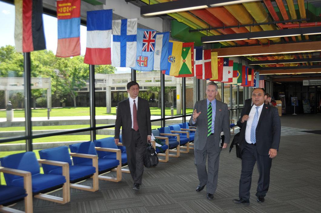Ambassador Djumaliev in UVU's Hall of Flags with Dr. Rusty Butler & Dr. Baktybek Abdrisaev