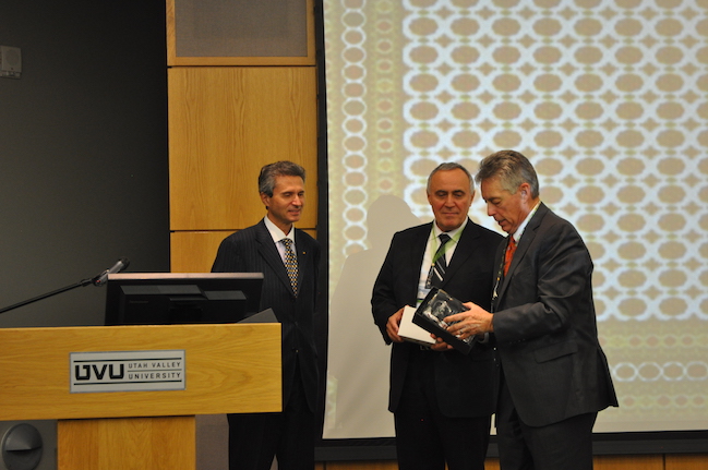 Ambassador Meret Orazov and Ambassador Ion Jinga receive recognition awards from Dr. Rusty Butler.