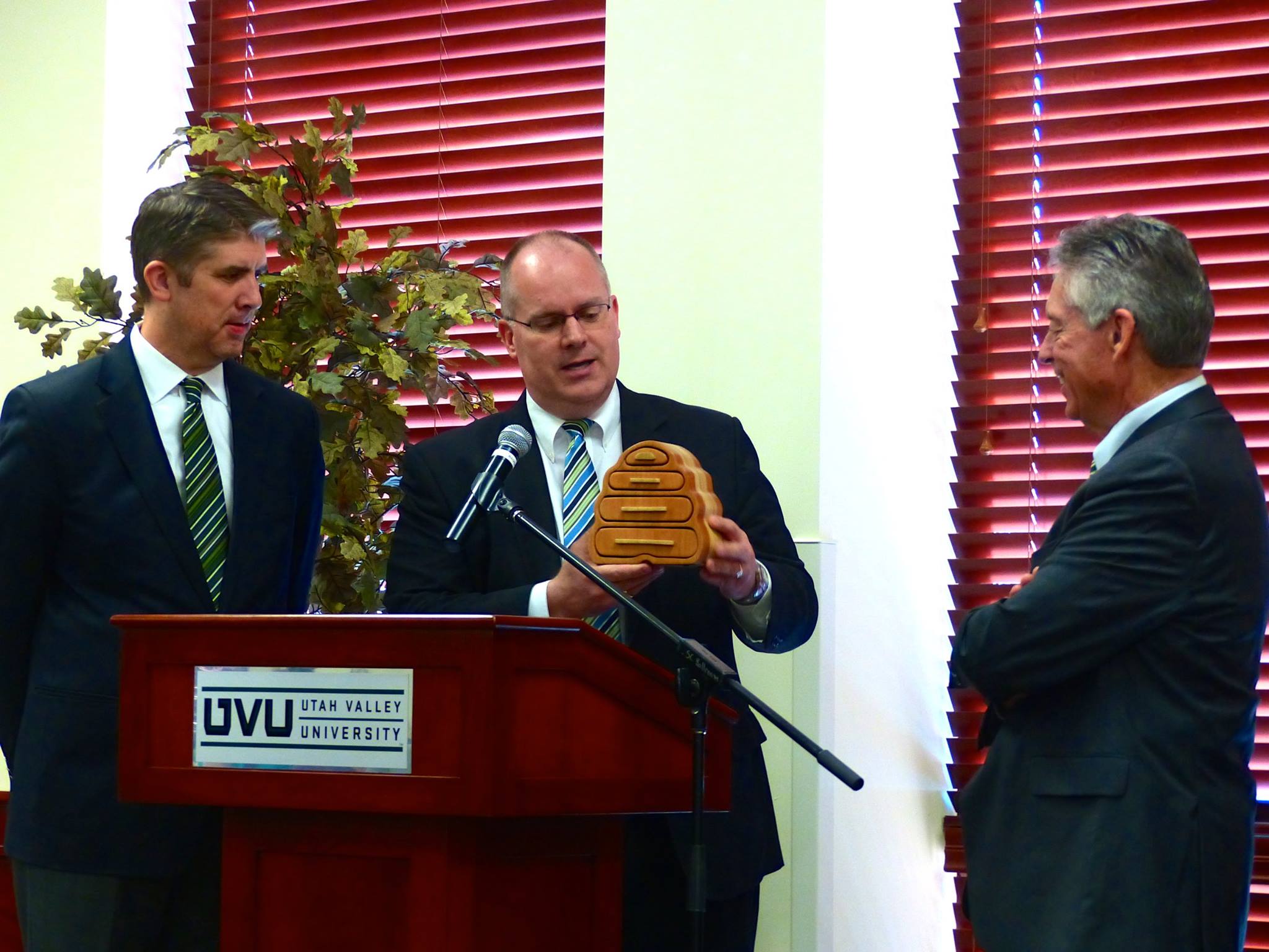 President Holland and VP Cameron Martin recognize Rusty on his retirement from UVU.