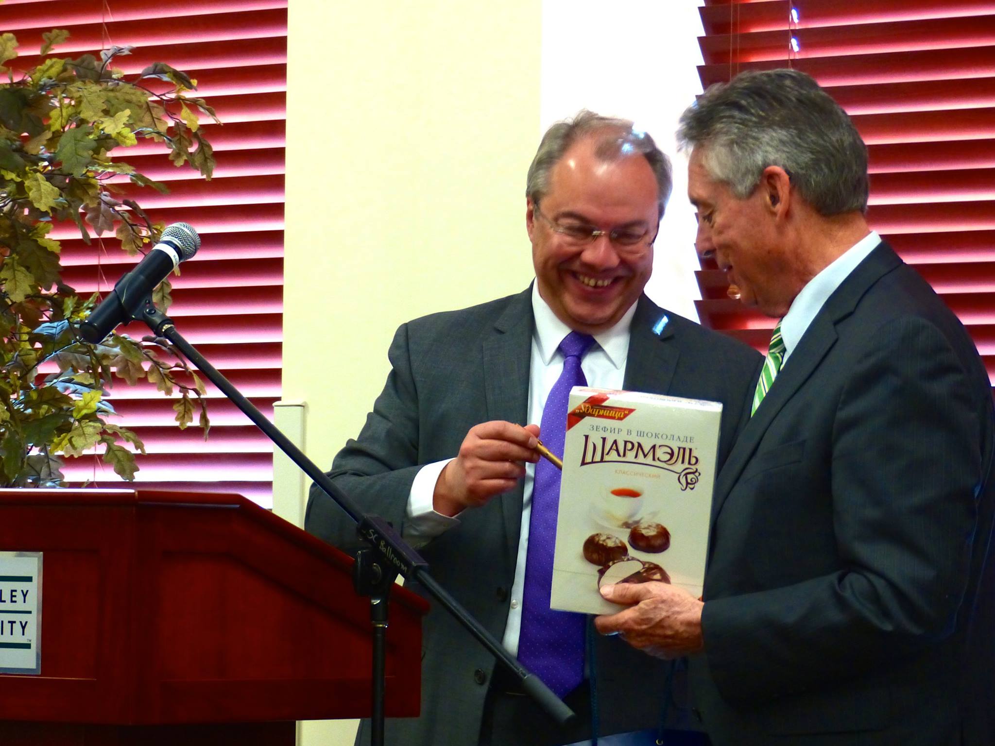 President Holland and VP Cameron Martin recognize Rusty on his retirement from UVU.