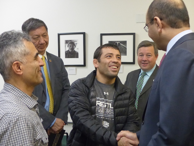 UVU's own assistant wrestling coach, Erkin Tadzhimetov (also from Uzbekistan) meets with Ambassador Madrakhimov.