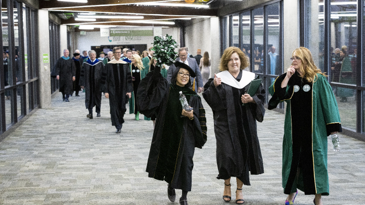 staff walking in the hall of flags