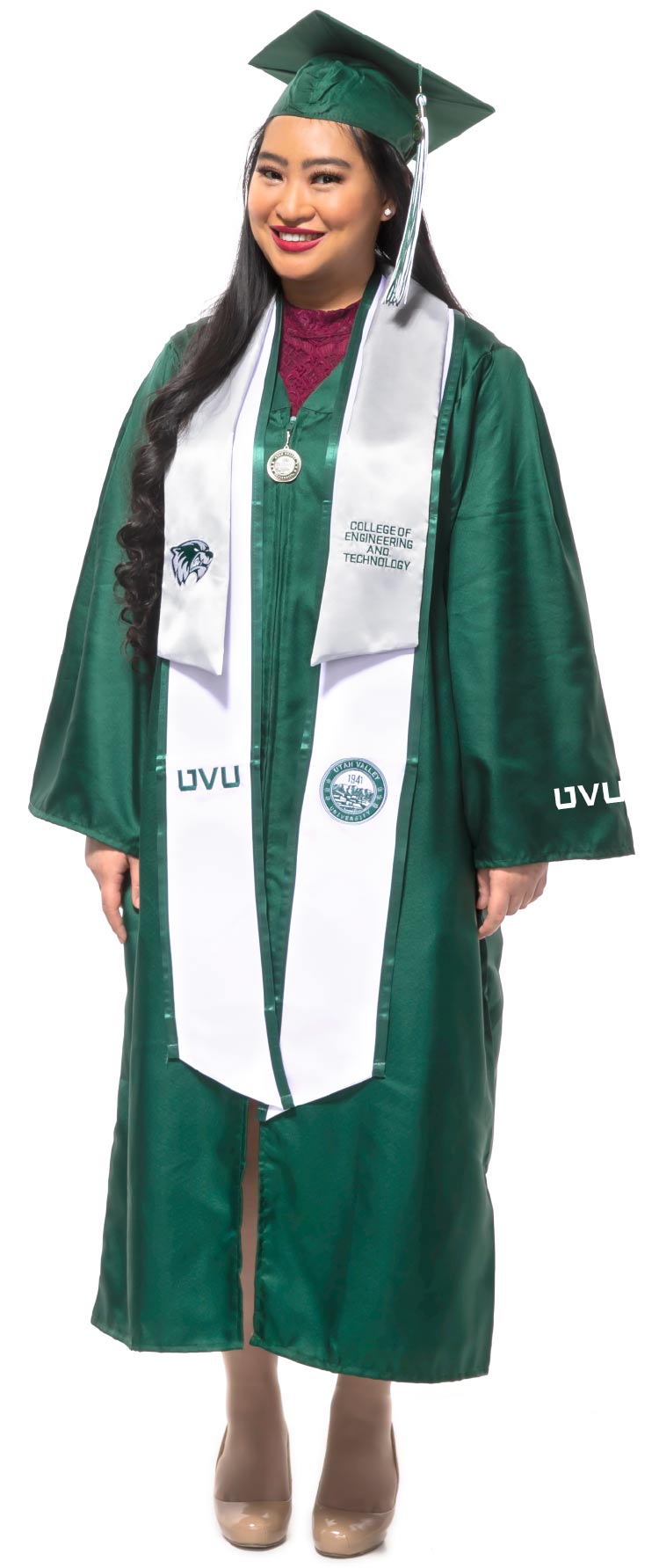 UVU women student in green UVU regalia.