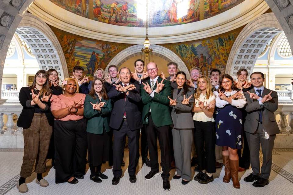 2026 Legislative Interns Group Photo with UVU Hands