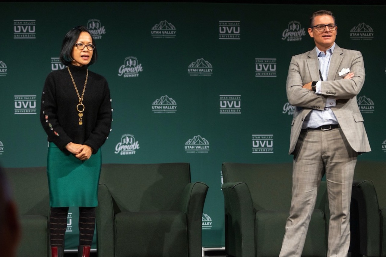 President Tuminez on stage with Curtis Blair