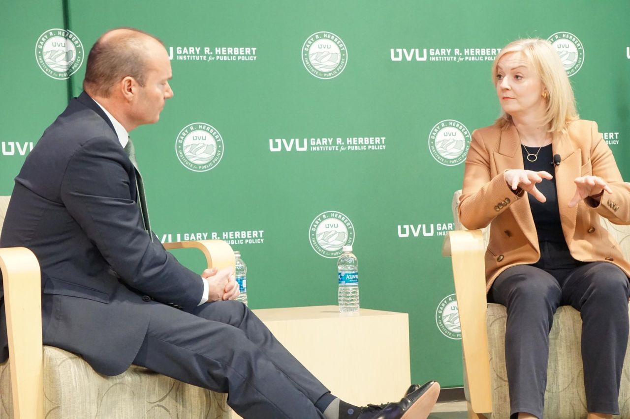 Mike Lee and Liz Truss speaking at UVU with Herbert Institute background