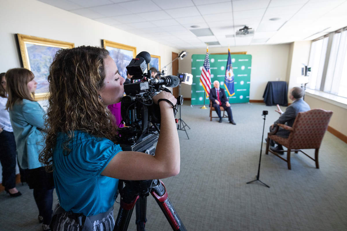 Person filming Mike Pence during an interview