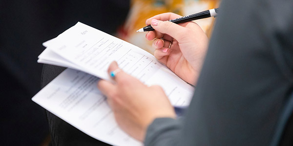 Woman holding papers