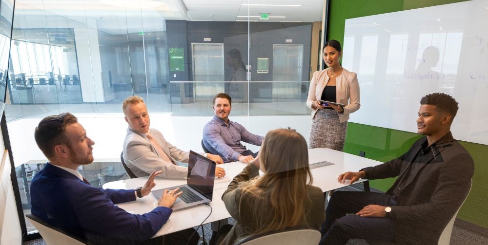 person leading a team meeting