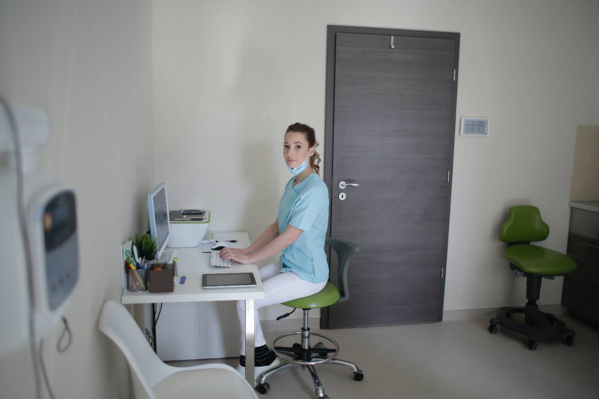Nurse typing on a computer