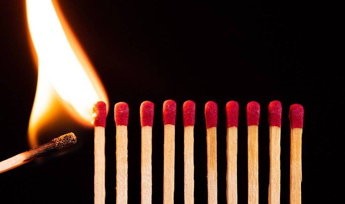 Line of Matches lit match lighting a line of unlit matches