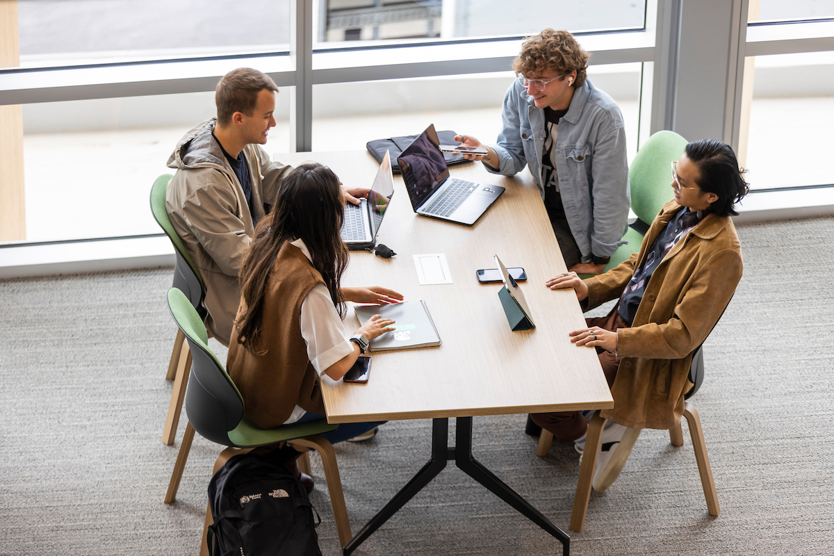 Four students studying at a table