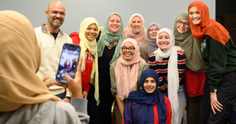 Students at a Hijab event, having interfaith dialogue 