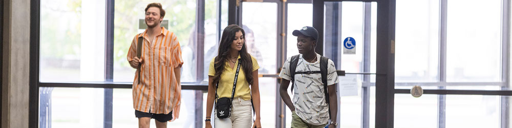 international UVU students walking together in the Clark Building