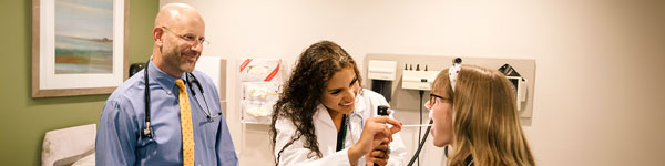 Student being seen by doctors at the health center