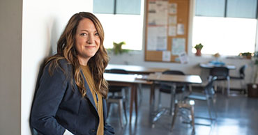 woman standing at entrance to classrom