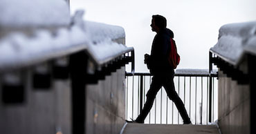 man walking in the snow