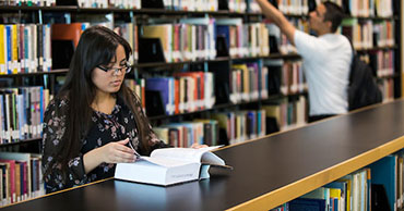 woman reading in a library