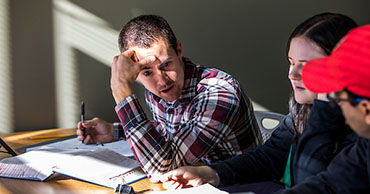 student studying with textbook