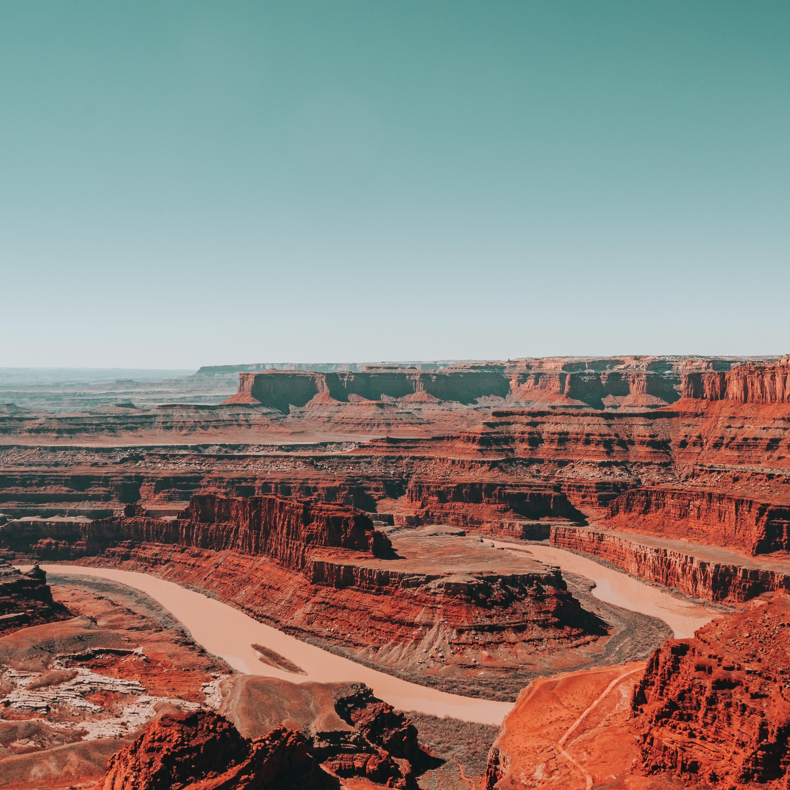 decorative red plateaus against blue sky