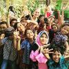 Children in photo making the peace sign