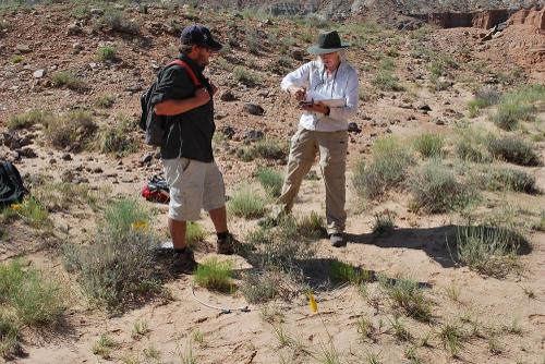 Matt Want surveying land with another individual at Capitol Reef National Park