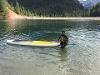 Student in water with paddle board