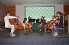 Students doing a cello performance