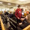 President Holland interacts with students in the Fulton Library