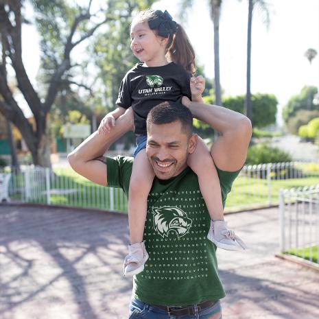 Man with child on his shoulders.