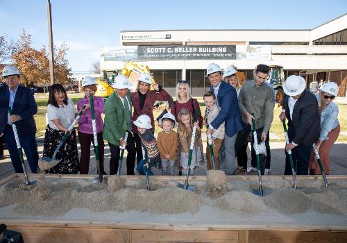 The Keller family breaks ground