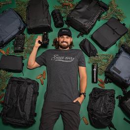 Photographer surrounded by bags